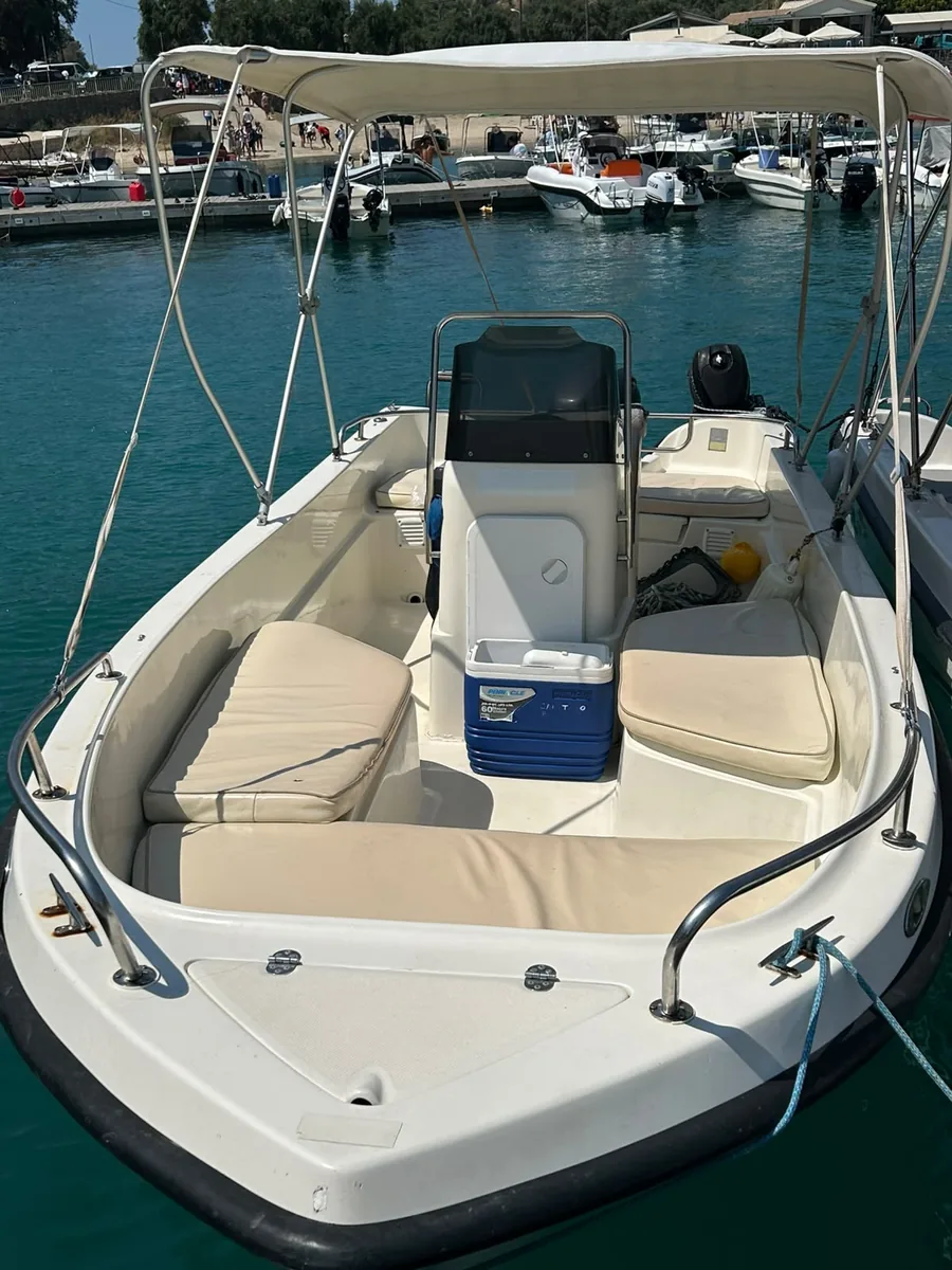 The Nemo's cockpit seen from the bow — centre console, cushioned seating and a coolbox.